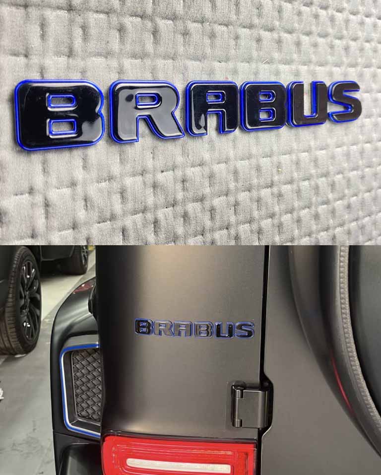 Tail Brabus badges black letters with blue trim on Mercedes trunk