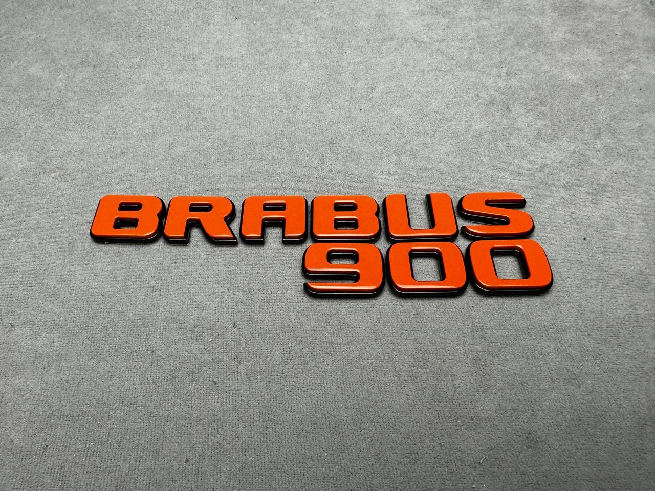 Brabus 900 Tail Emblem in Full Orange color