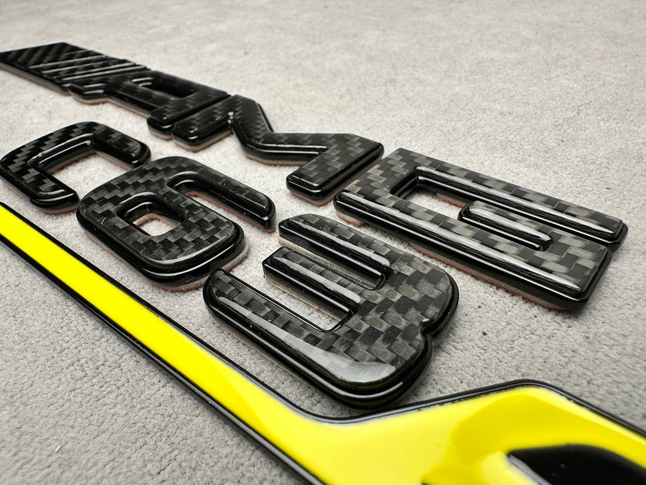 2025-11-24 14.20.13 AMG C 63 S Rear Emblem Metal Black and carbon Brabus 2026 - Image 1