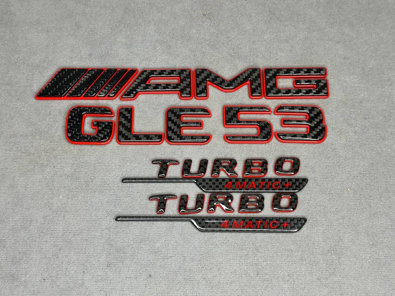 2026-01-27 17.22.02 AMG GLE 53 Turbo 4MATIC Red and Carbon Emblem Set - Image 1